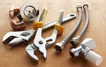Plumbing tools and supply lines ready for the job